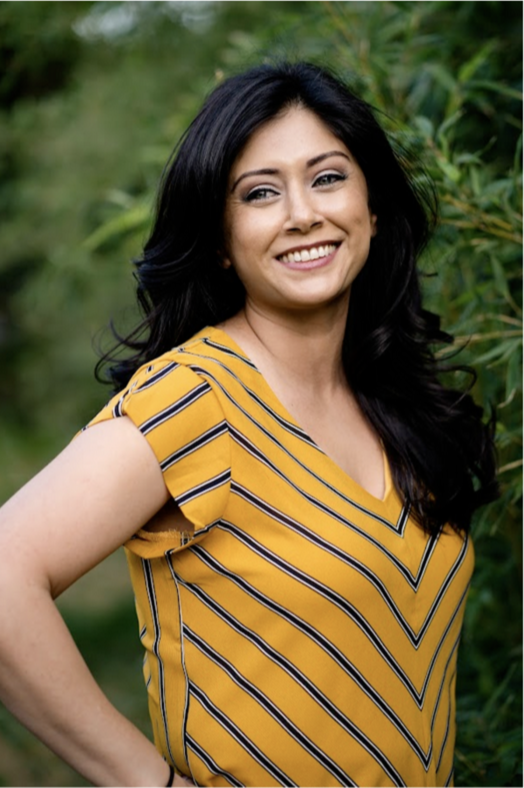 Kerren Archuleta in a yellow striped shirt